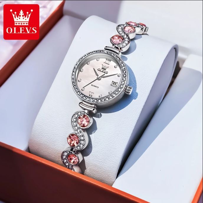 Silver watch with pink gemstones in a white box, featuring the OLEVS brand.