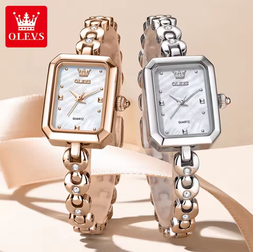 Two OLEVS watches with rose gold and silver bands on a beige background