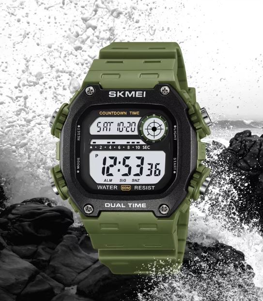 Green digital watch with water resistance features on a rocky background