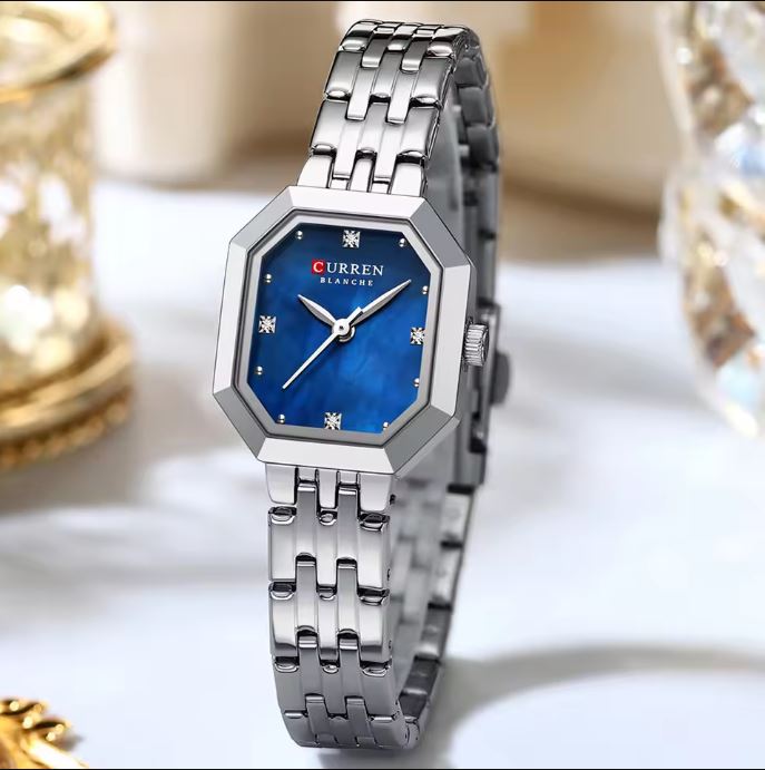 Silver watch with blue dial on a white background