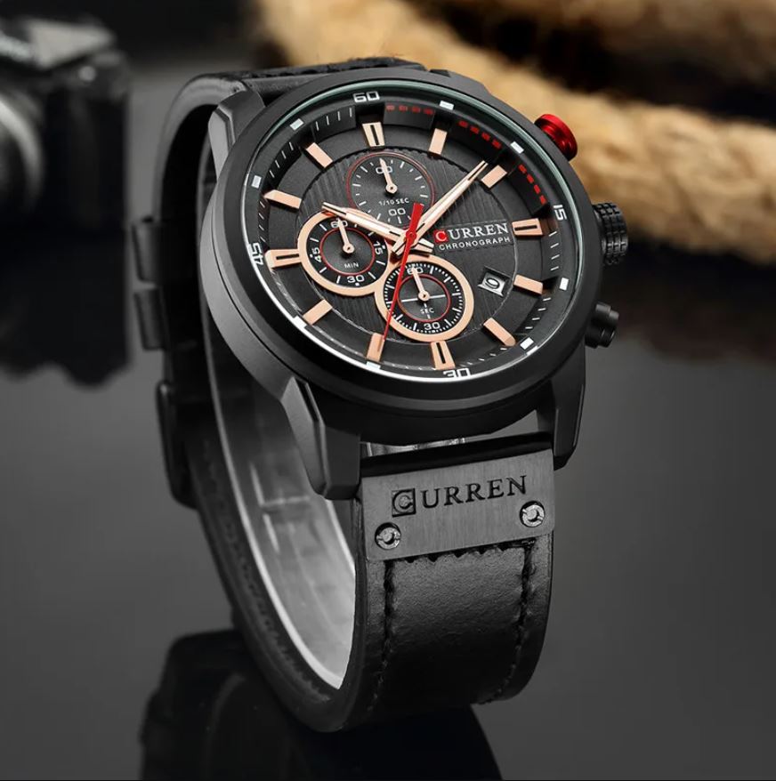 Black Curren watch with detailed face on a dark background