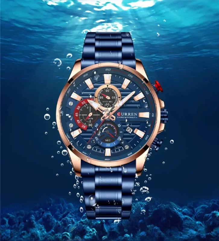 Curren watch with blue strap on a blue underwater background