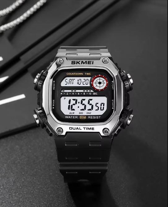 Digital watch with a black strap on a dark background