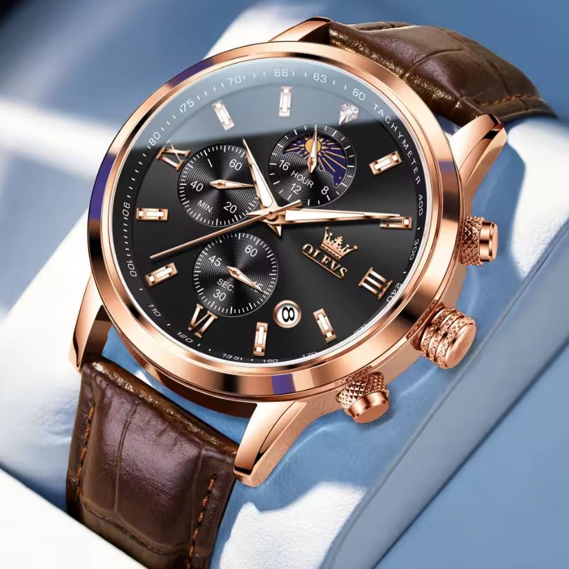 Luxury watch with brown leather strap and rose gold casing on a light blue background