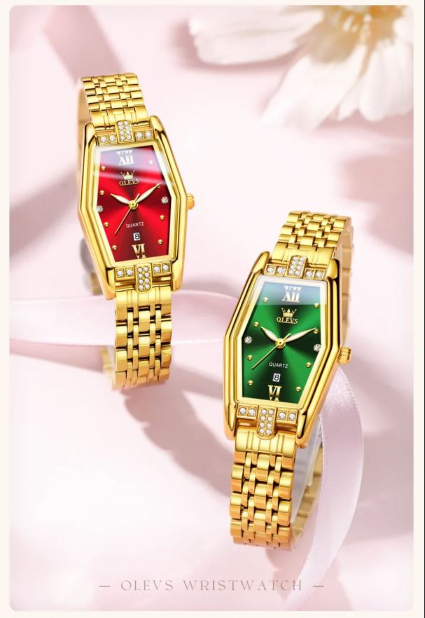 Two gold wristwatches with red and green faces on a soft pink background