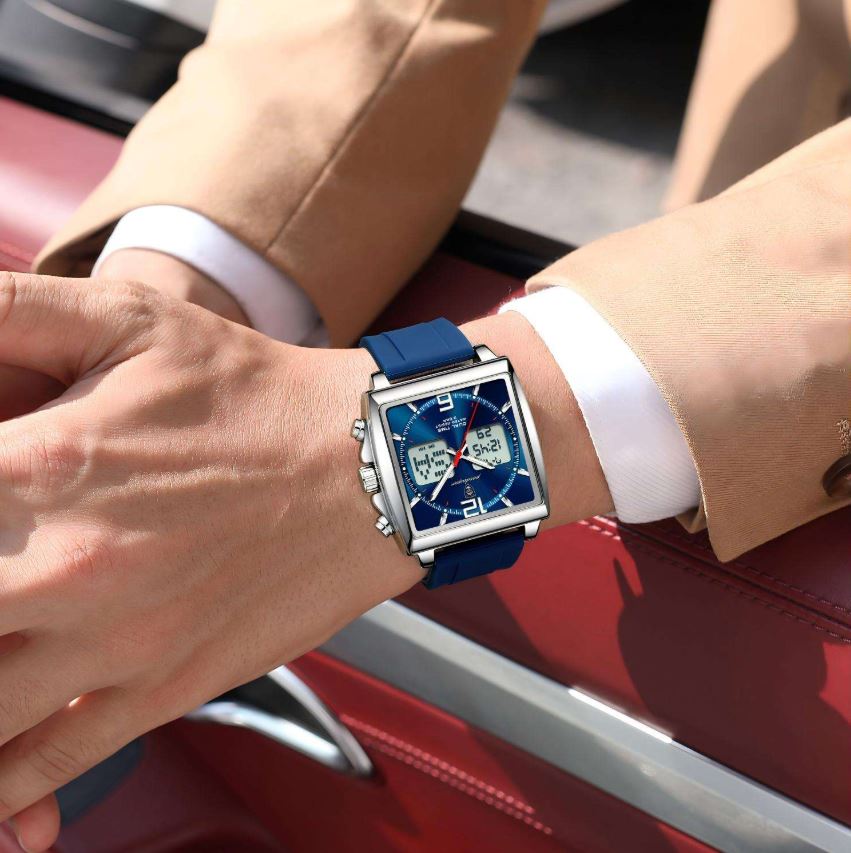 Person wearing a blue watch on a red car background