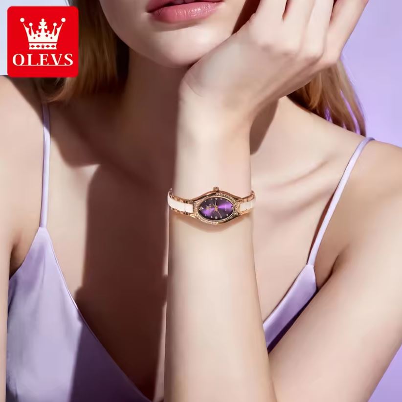Woman wearing a purple watch with 'OLEVS' branding in the corner.