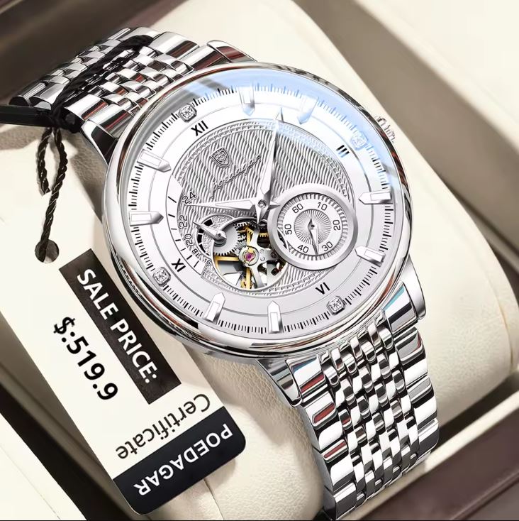 Silver wristwatch with a visible brand name on a white surface