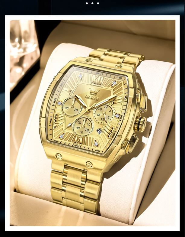 Gold wristwatch with detailed face on a white cushion