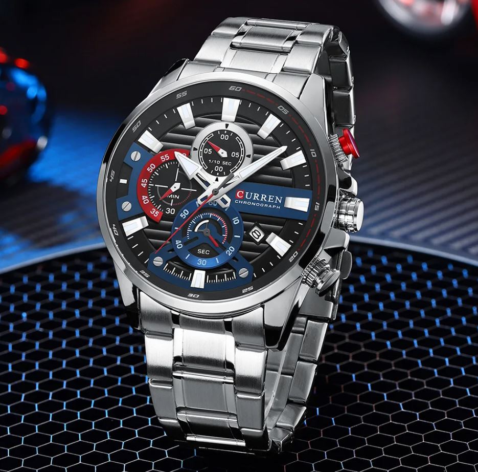 Silver wristwatch with a detailed face on a dark textured background