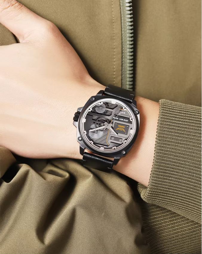 Person wearing a detailed wristwatch with a green jacket