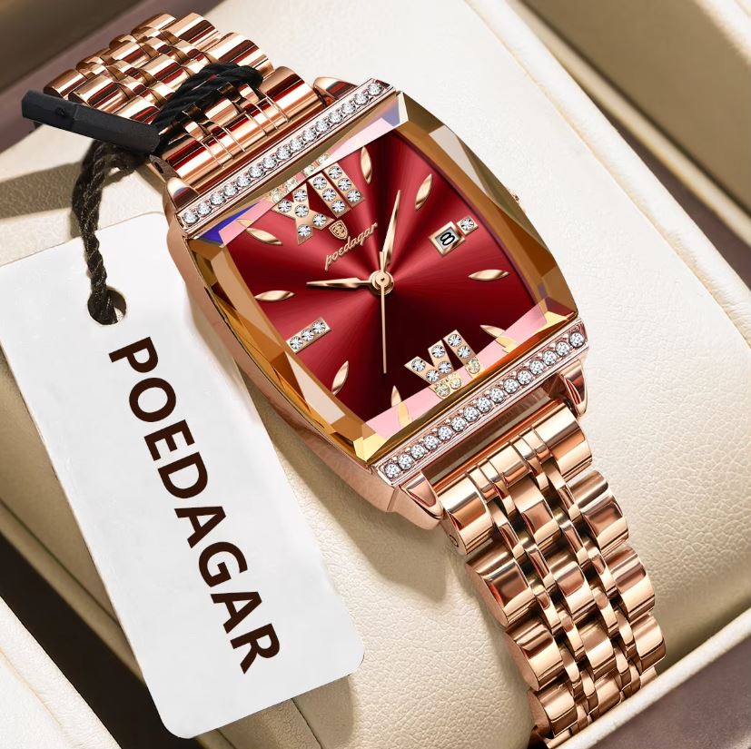Rose gold watch with red face and diamond accents on a white box, featuring the brand 'POEDAGAR'.