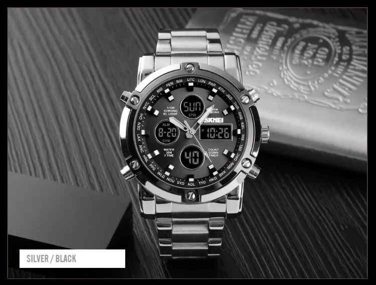 Silver and black digital wristwatch on a textured surface