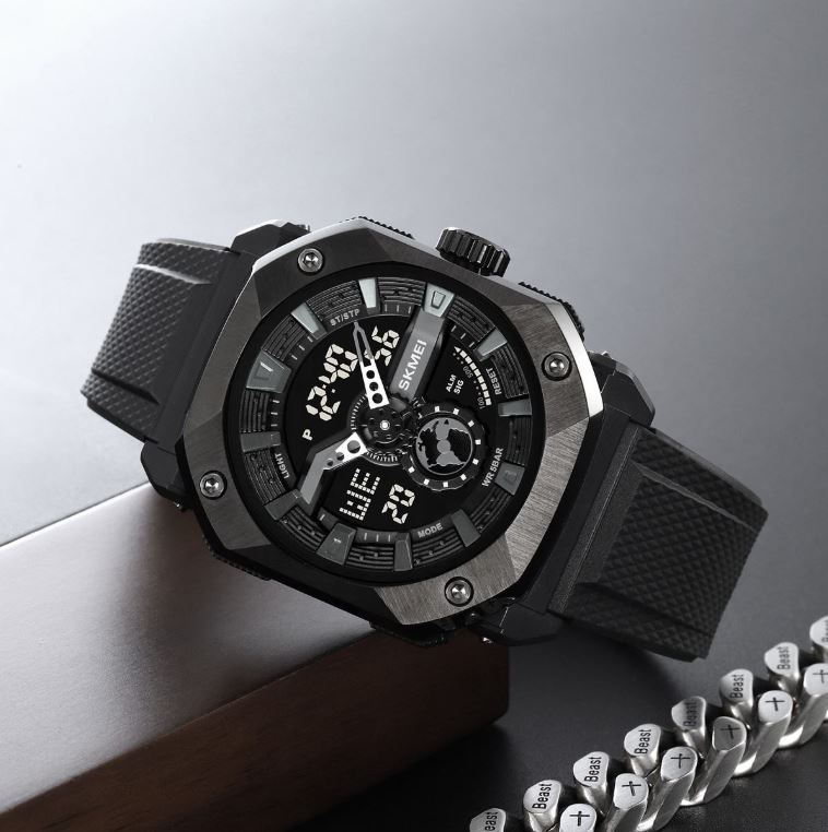 Black digital wristwatch with detailed face on a reflective surface