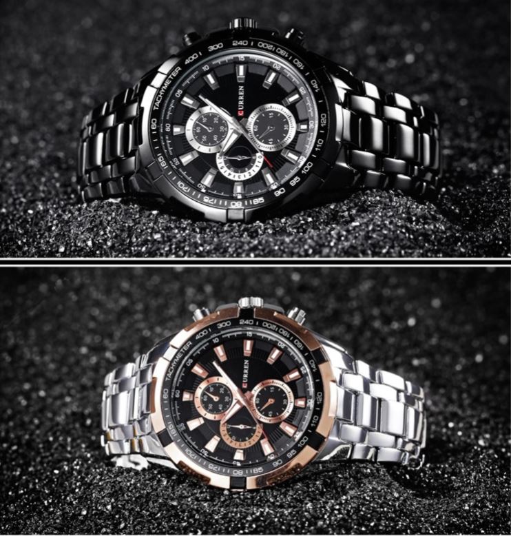 Two watches with black and silver metal bands on a dark textured background