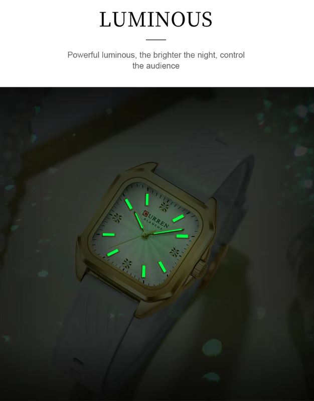 Luminous watch with green glow on a dark background
