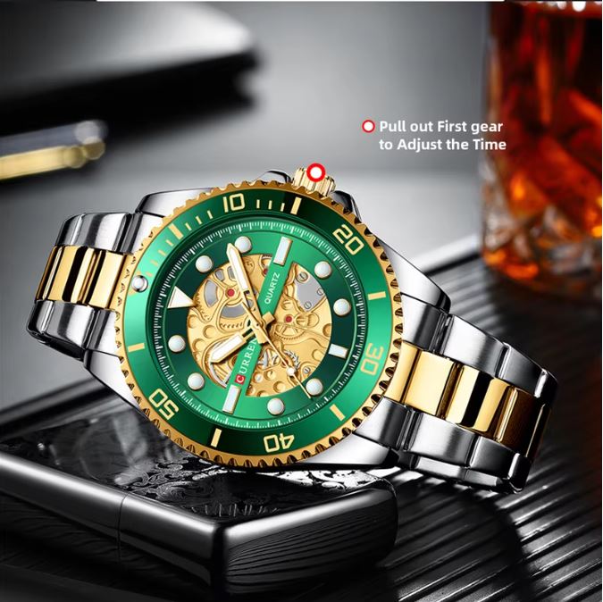 Luxury watch with green face and gold accents on a reflective surface.