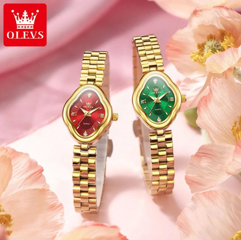 Two gold wristwatches with red and green faces on a pink floral background, featuring the OLEVS brand.