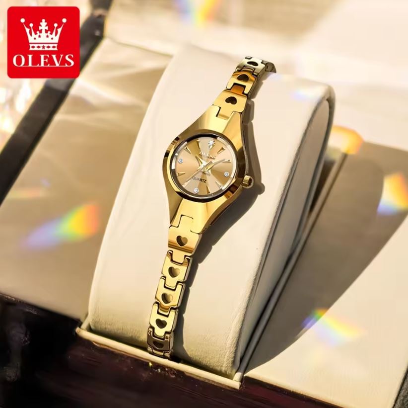 Gold watch in a display case with OLEVS branding.