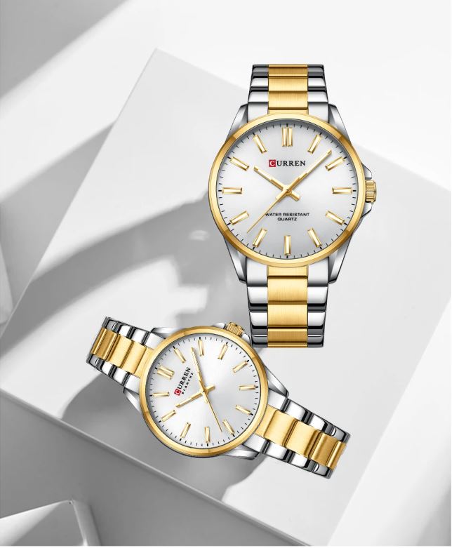 Two gold and silver watches on a white background
