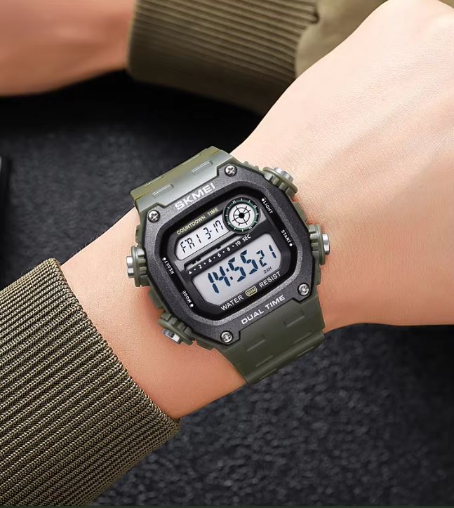 Green digital watch on a wrist with a dark background