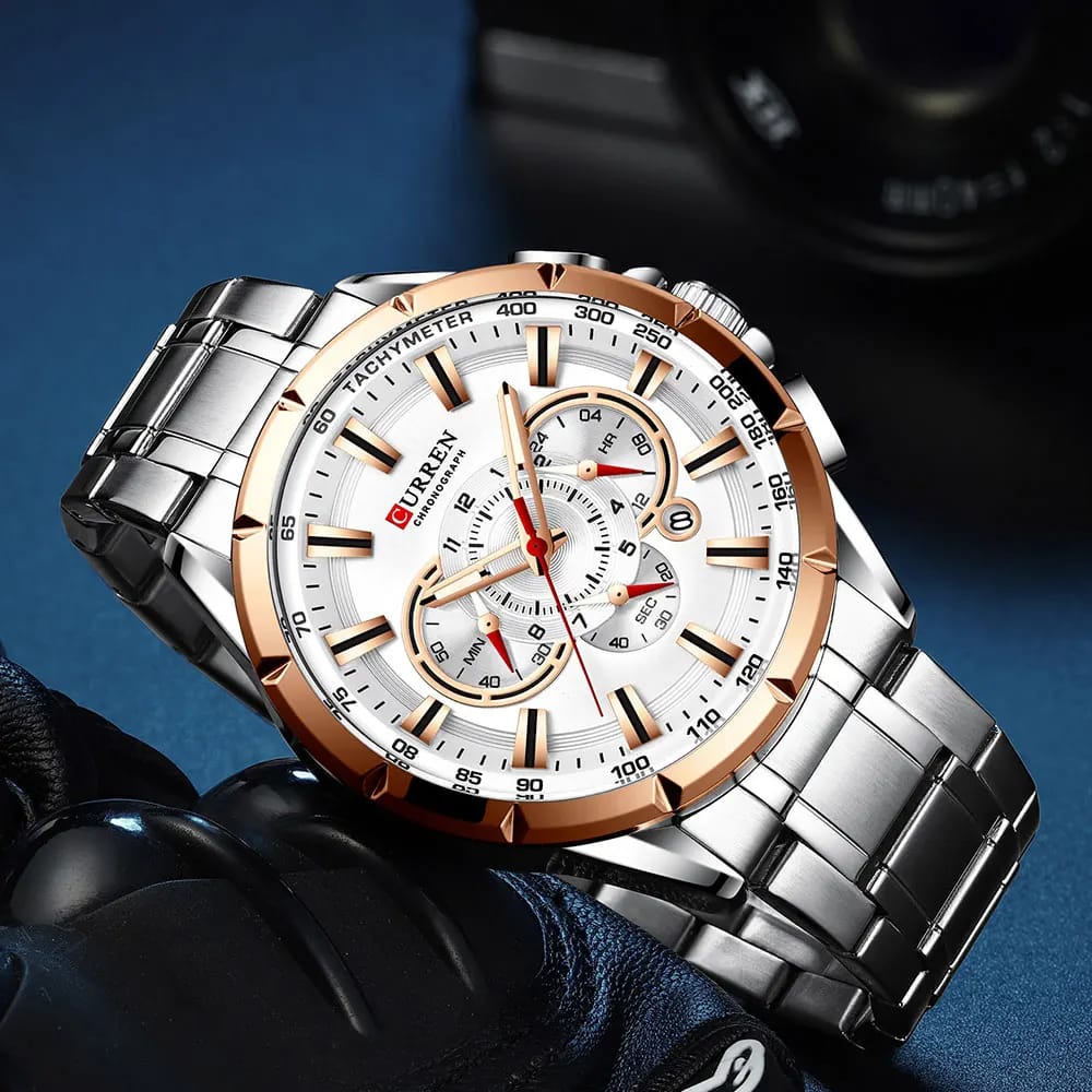 Luxury watch with a silver and rose gold design on a dark background