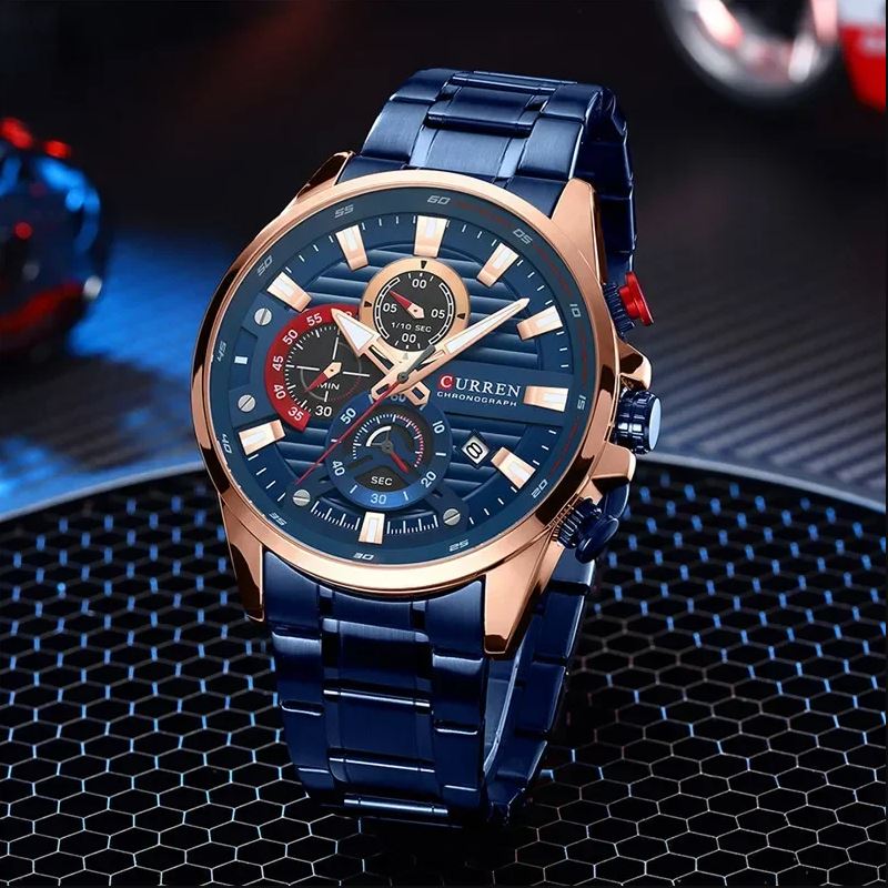 Blue Curren watch with detailed face on a dark textured surface