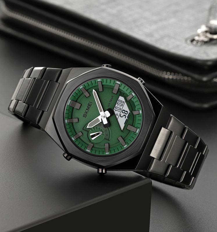 Green and black watch with digital display on a dark surface