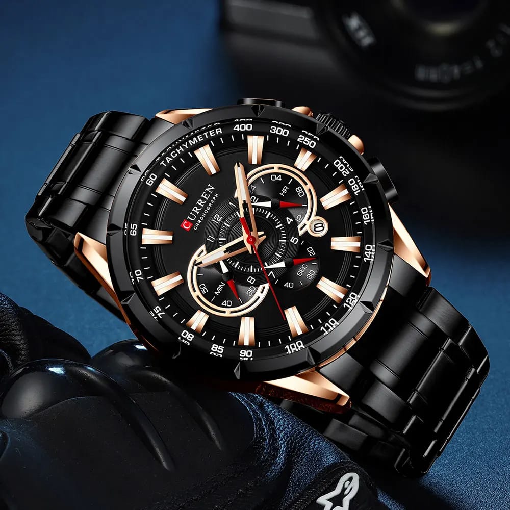 Luxury watch with black and rose gold design on a dark background