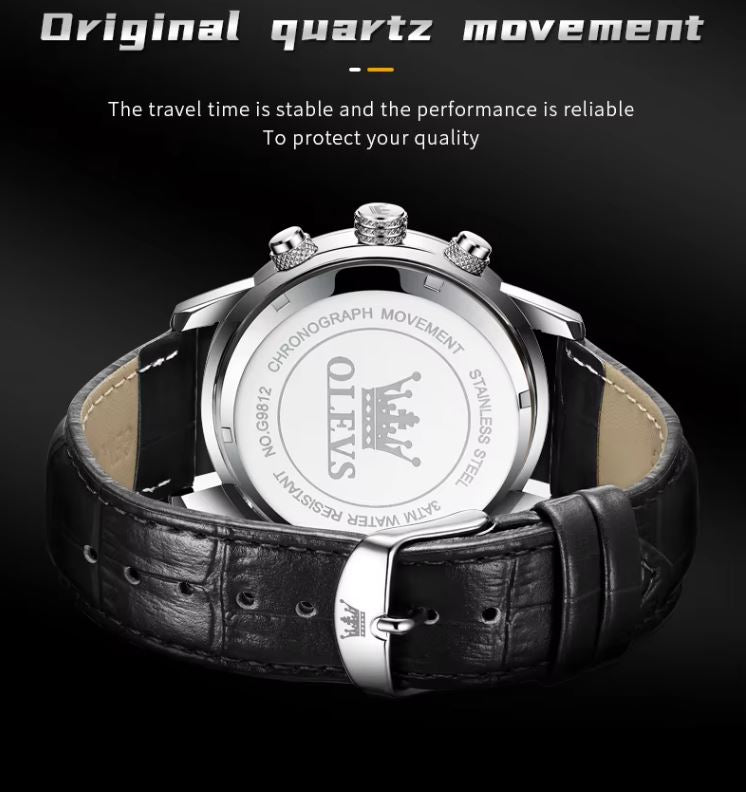 Wristwatch with black leather strap and silver case on a dark background