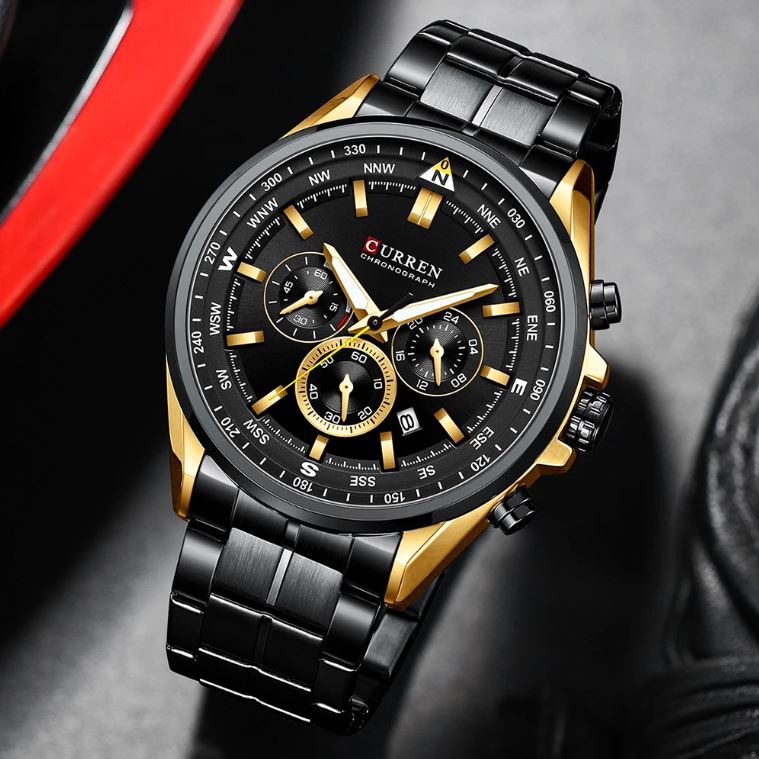 Curren watch with black and gold design on a dark background