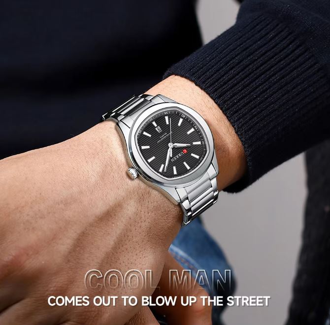 Silver wristwatch on a person's wrist with a humorous text overlay.