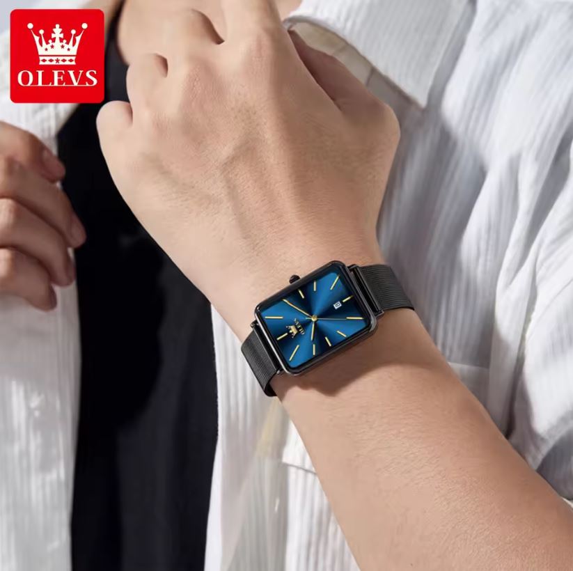 Person wearing a black smartwatch with a blue screen, branded 'OLEVS'.