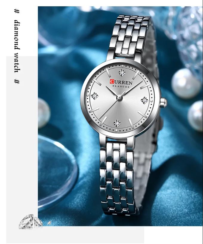 Silver Curren watch on a blue background with pearls
