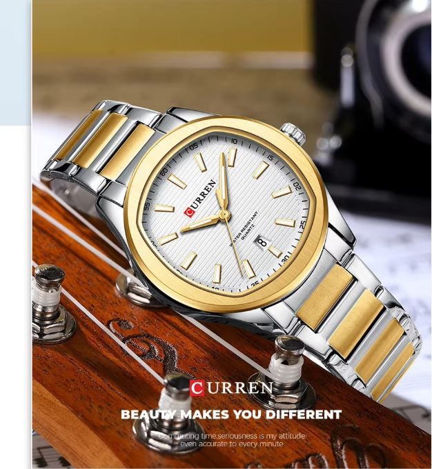 Curren watch with gold and silver band on a wooden surface