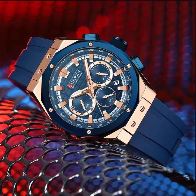Luxury watch with blue and rose gold design on a red and blue textured background