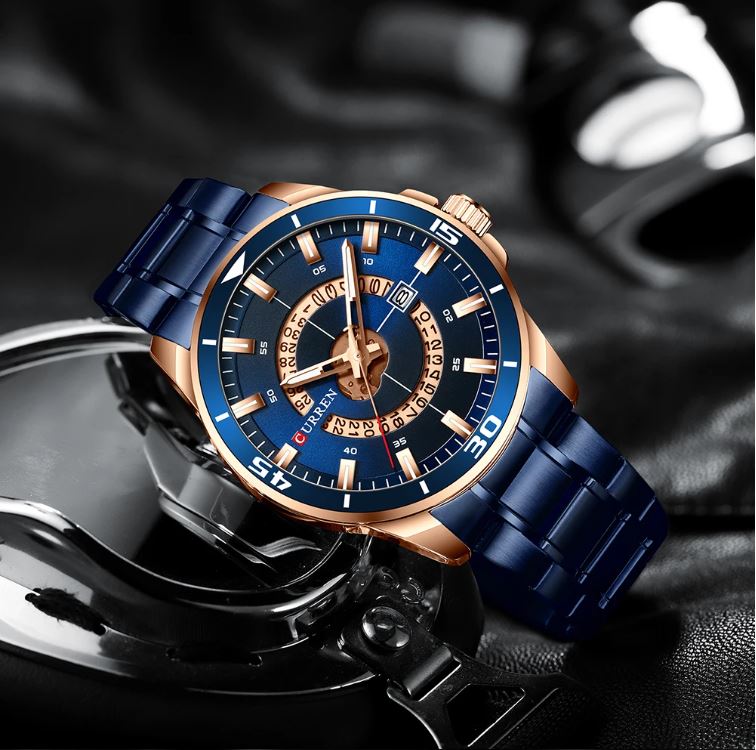 Luxury watch with blue and rose gold design on a dark background