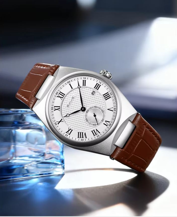 Watch with brown leather strap on a reflective surface