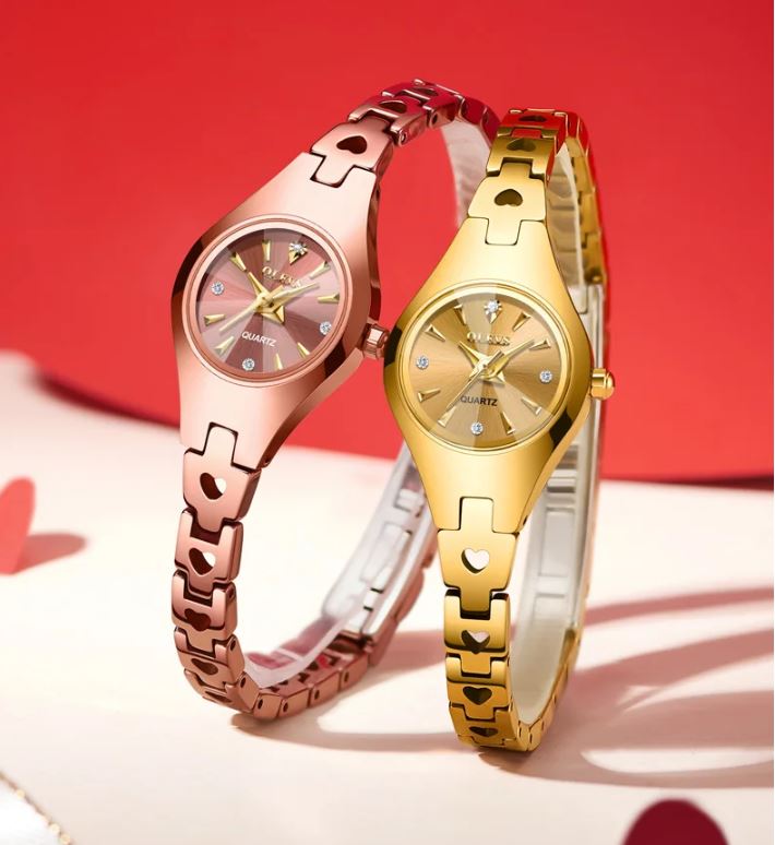 Two gold and rose gold watches on a red and white background