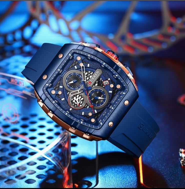 Blue wristwatch with intricate design on a blue background