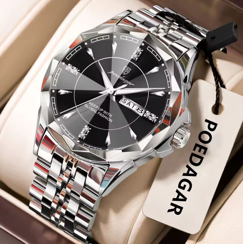 Silver watch with black face on a beige surface, featuring the brand 'POEDAGAR'.