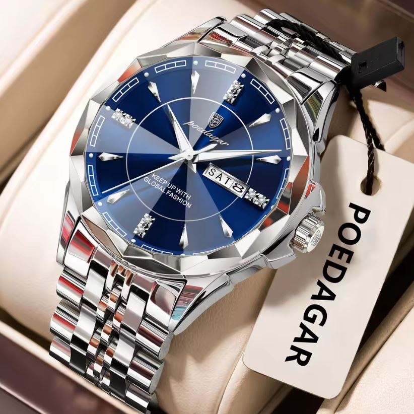 Silver watch with blue face on a beige surface, featuring the brand 'POEDAGAR'.