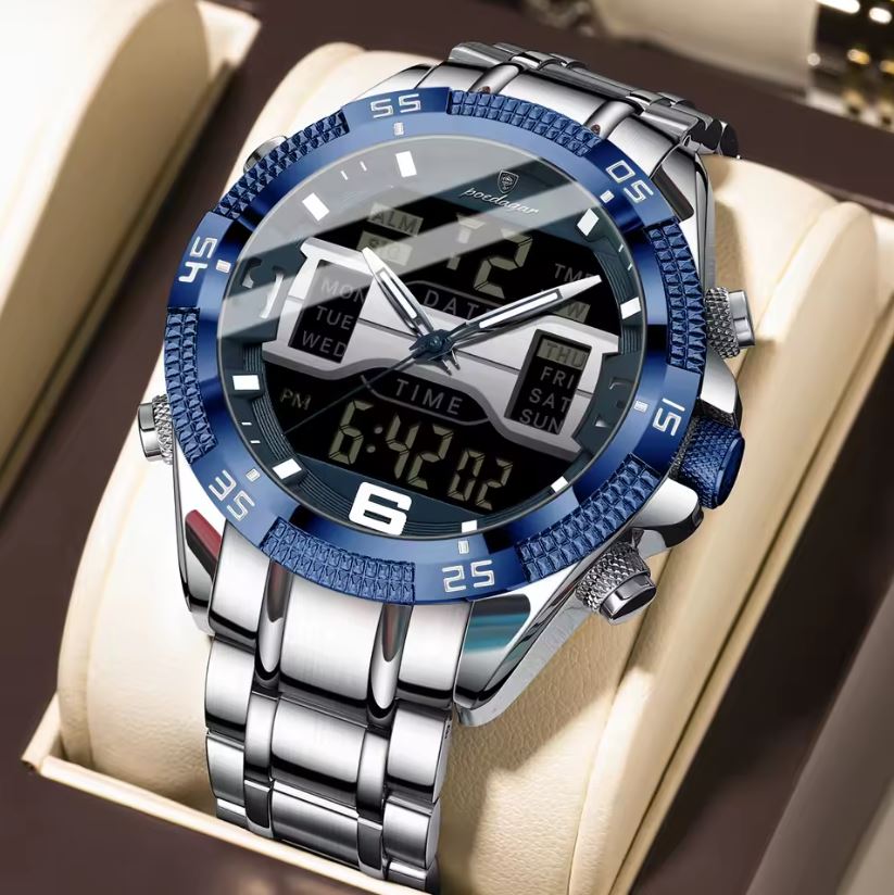 Silver and blue wristwatch with digital display on a beige cushion