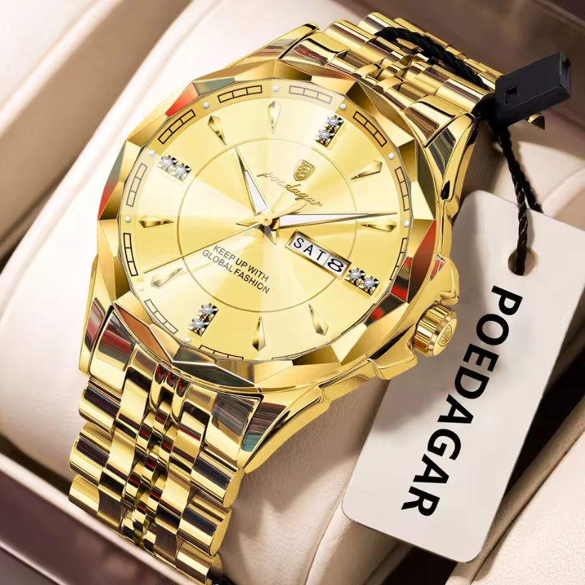 Gold watch with a visible brand tag on a beige background