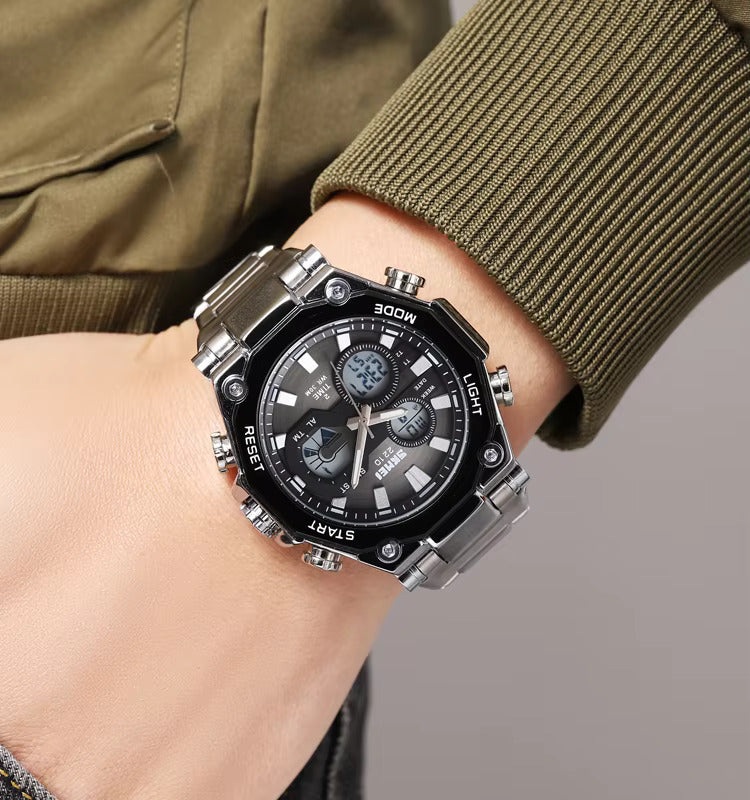 Black and silver watch on a wrist with a green jacket background