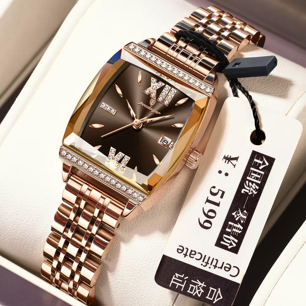 Luxury rose gold watch with diamond accents on a white box