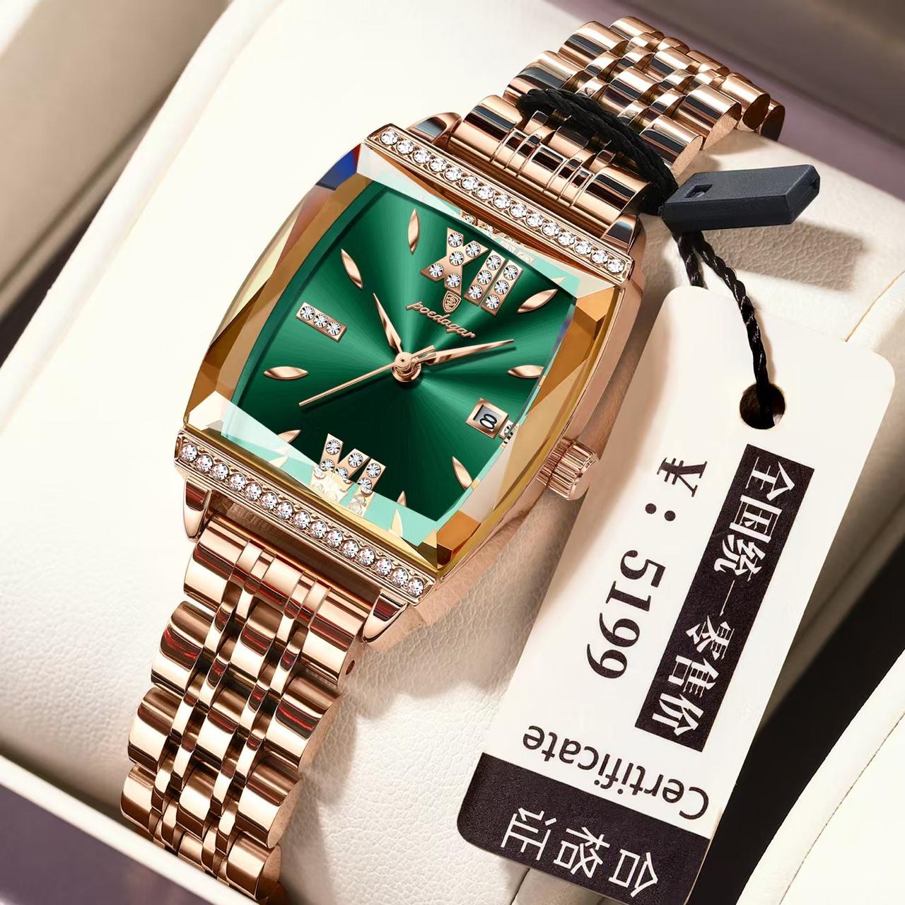 Luxury watch with rose gold strap and green face on a white box