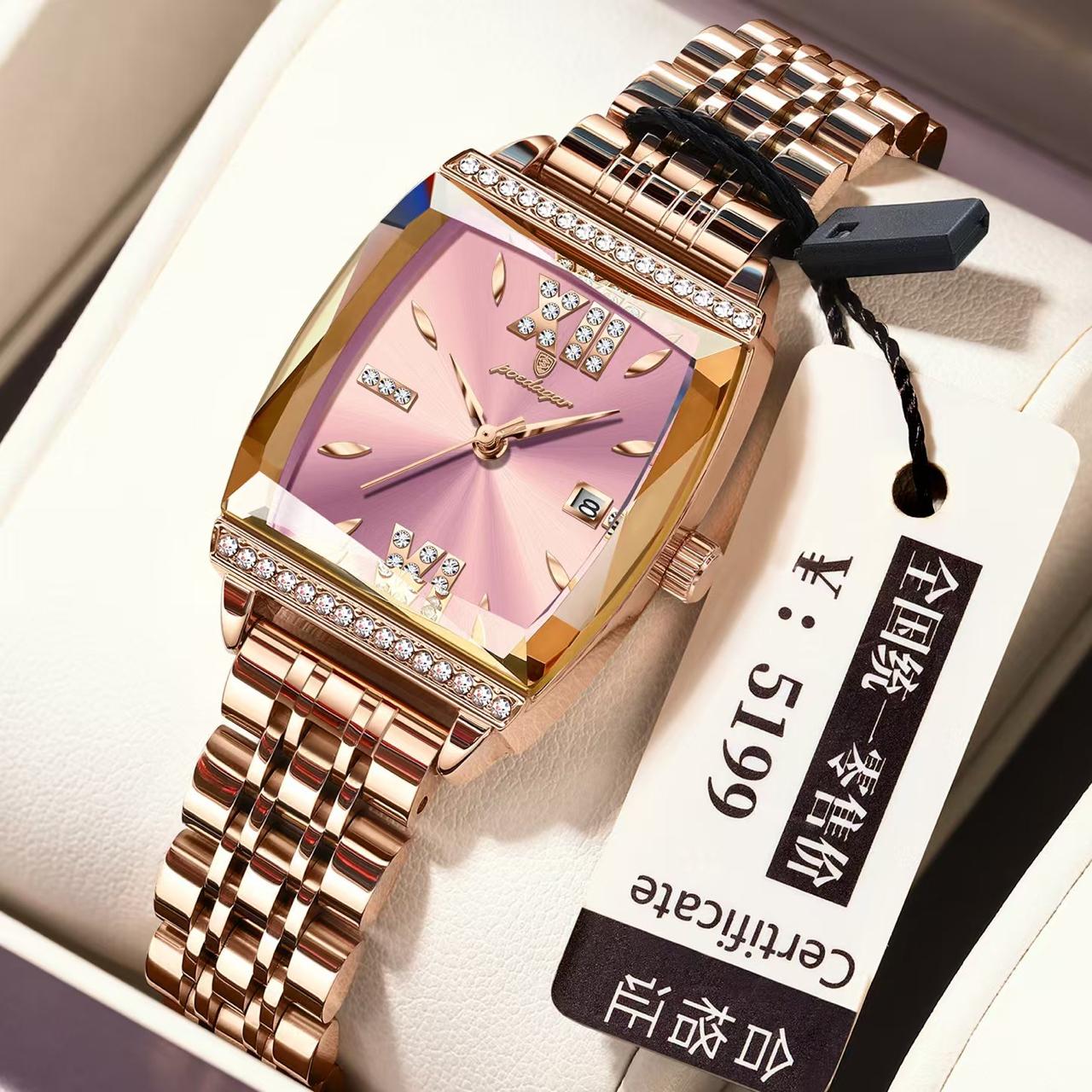 Rose gold watch with pink face and diamond accents on a white box, accompanied by a price tag.