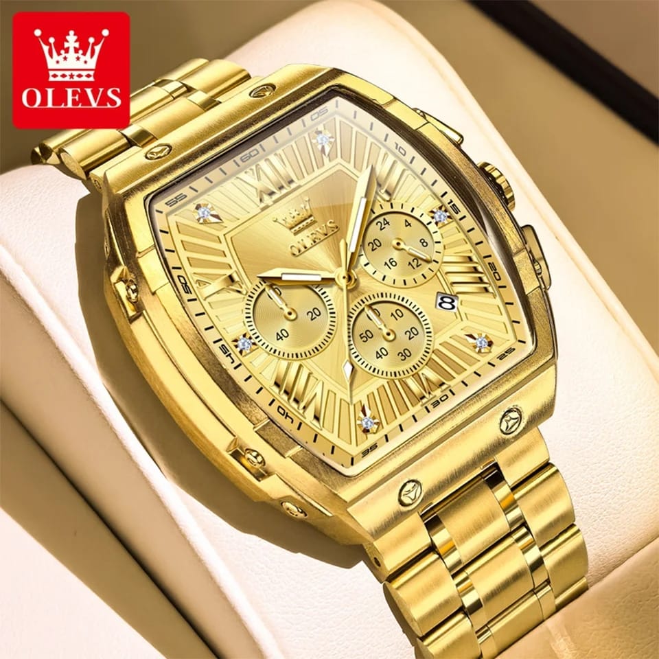 Gold watch with detailed face and OLEVS branding on a beige background