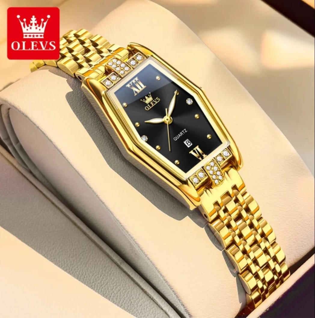 Gold wristwatch with black face on a light background, featuring the OLEVS brand.